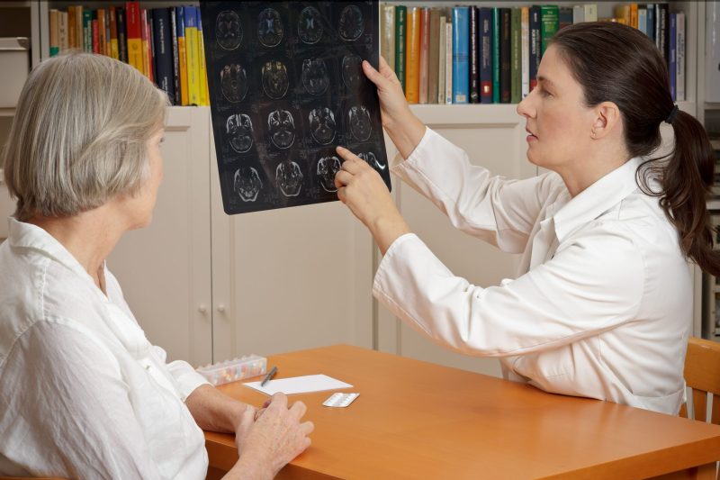 doctor reviewing xray scans with a patient in Washington DC