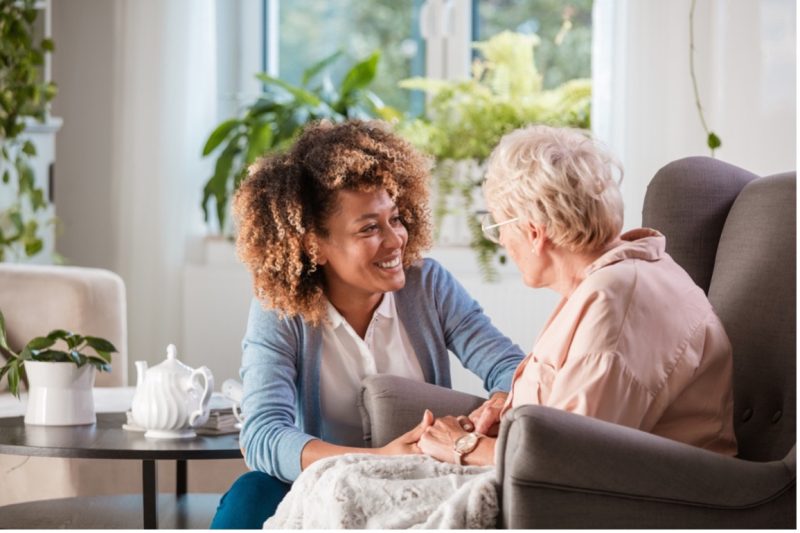 The grandmother talking with granddaughter in home at Rockville, MD