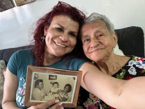 Daughter and Mother with old photo in Rockville, MD