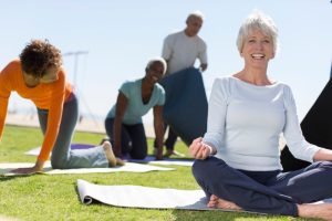 Seniors doing exercise outdoors in MD