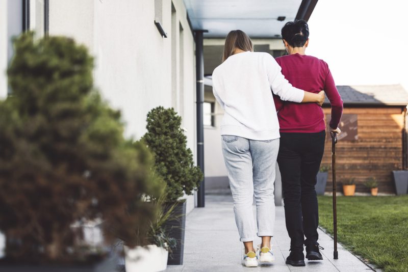 Caregiver helping a senior with mobility